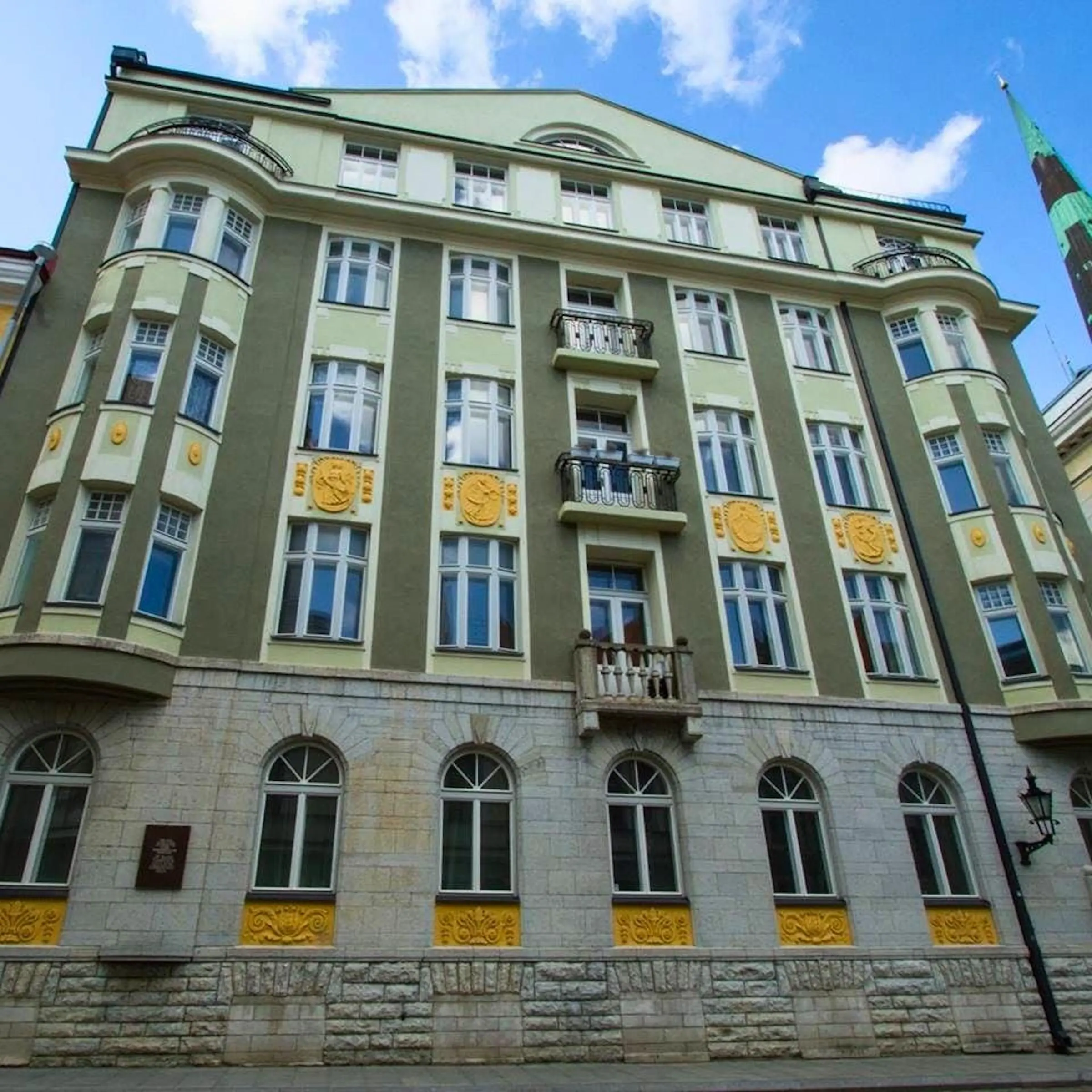 The imposing stone facade of the KGB Prison Cells building at Pagari 1 in Tallinn