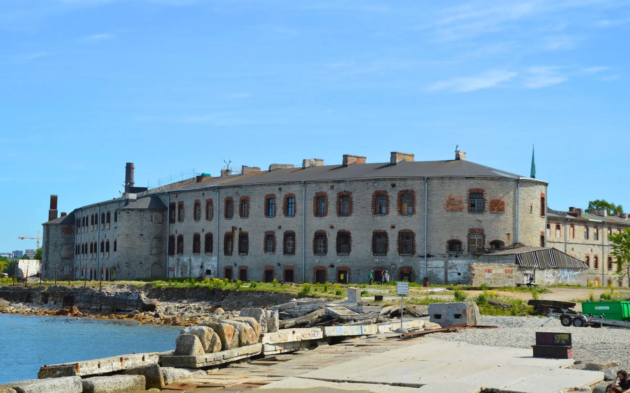 The imposing limestone exterior of Patarei Prison facing the Baltic Sea