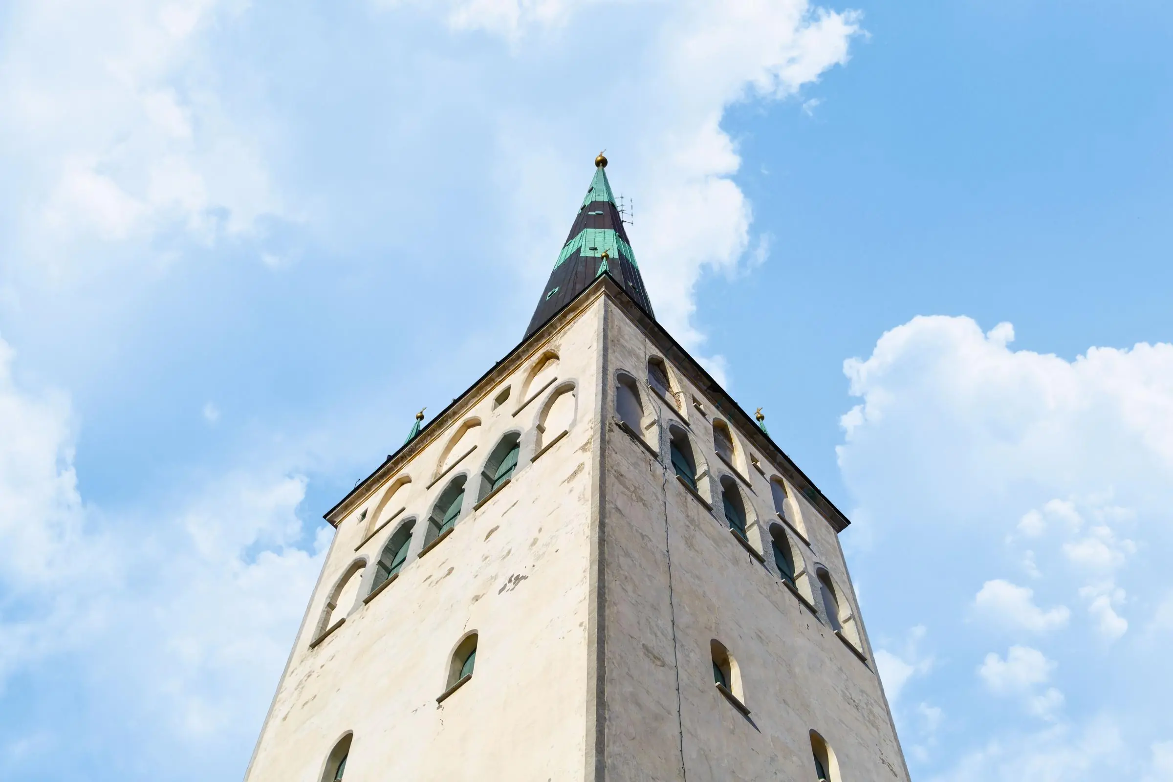 St. Olaf's Church Spire The towering spire of St. Olaf's Church rising above the red roofs of Tallinn Old Town