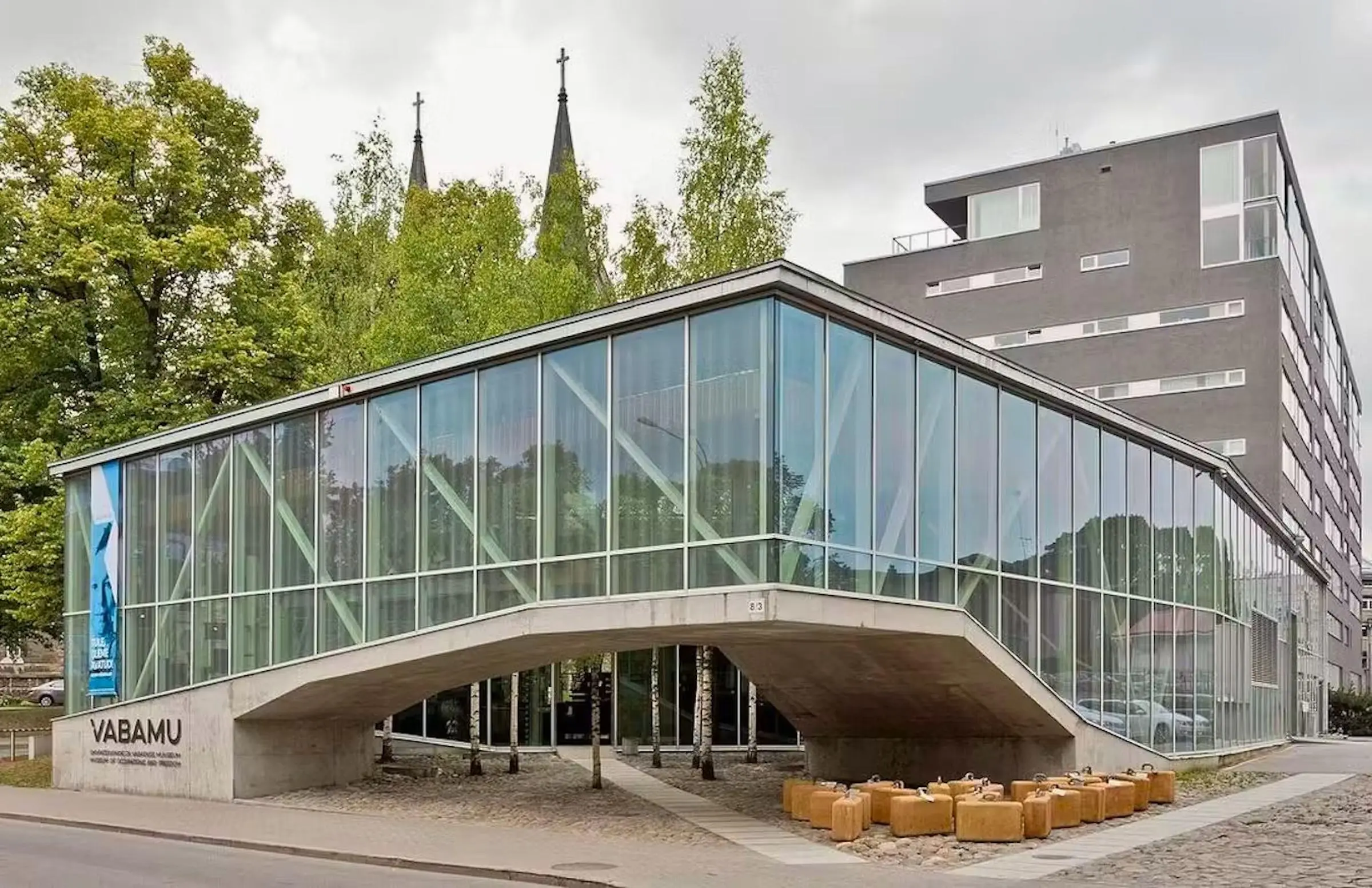 The modern glass exterior of the Vabamu Museum of Occupations and Freedom in Tallinn